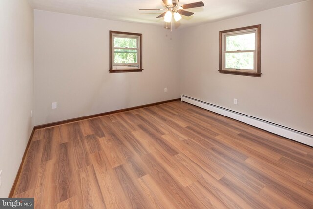 640 Bollinger Rd, Littlestown, PA 17340 - empty room featuring ceiling fan, light wood finished floors, and a baseboard radiator