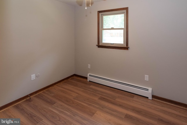 640 Bollinger Rd, Littlestown, PA 17340 - empty room featuring a baseboard radiator, wood finished floors, and a ceiling fan