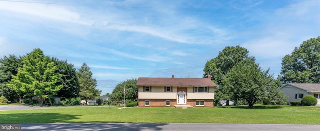 640 Bollinger Rd, Littlestown, PA 17340 - raised ranch with a front lawn, brick siding, and a chimney