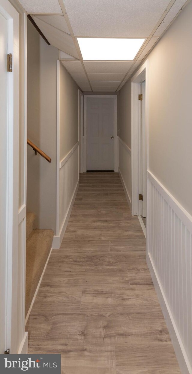 640 Bollinger Rd, Littlestown, PA 17340 - corridor with light wood-type flooring, a wainscoted wall, stairway, and a decorative wall