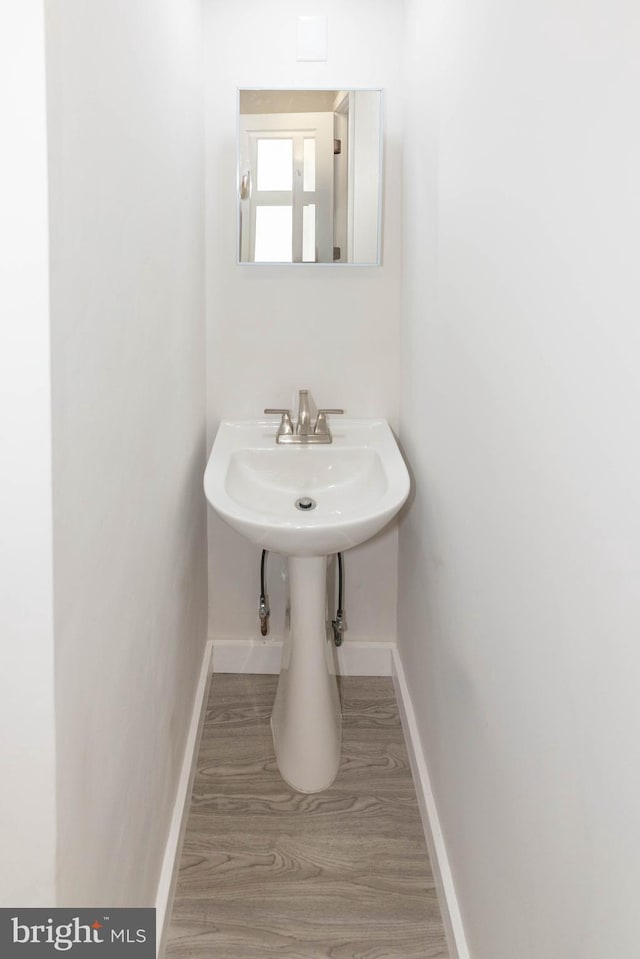 640 Bollinger Rd, Littlestown, PA 17340 - bathroom featuring baseboards and wood finished floors