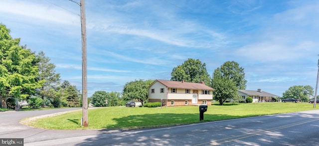 640 Bollinger Rd, Littlestown, PA 17340 - view of front of property featuring a front lawn, a chimney, and brick siding