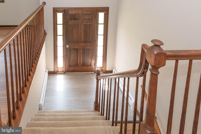 640 Bollinger Rd, Littlestown, PA 17340 - entrance foyer featuring wood finished floors, a baseboard radiator, and stairway