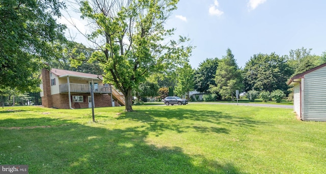 640 Bollinger Rd, Littlestown, PA 17340 - view of green lawn featuring stairway and a deck