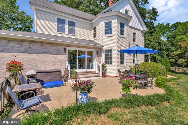 2090 Clearview Dr, Owings, MD 20736 - back of property with a patio, brick siding, entry steps, and a shingled roof