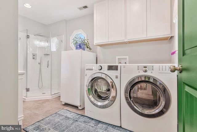 2090 Clearview Dr, Owings, MD 20736 - laundry area with washing machine and clothes dryer, light tile patterned floors, and recessed lighting