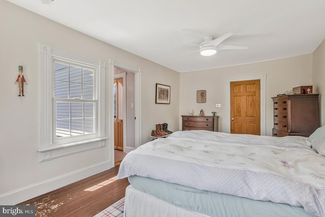 2090 Clearview Dr, Owings, MD 20736 - bedroom with wood finished floors, multiple windows, and ceiling fan