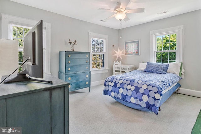 2090 Clearview Dr, Owings, MD 20736 - bedroom with light carpet, multiple windows, and ceiling fan