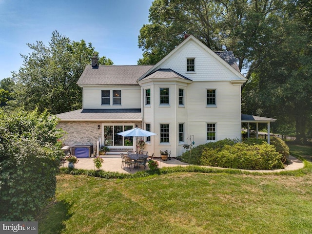 2090 Clearview Dr, Owings, MD 20736 - rear view of house featuring a lawn, a chimney, and a patio