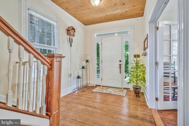 2090 Clearview Dr, Owings, MD 20736 - foyer featuring wood finished floors, wood ceiling, stairway, and ornamental molding
