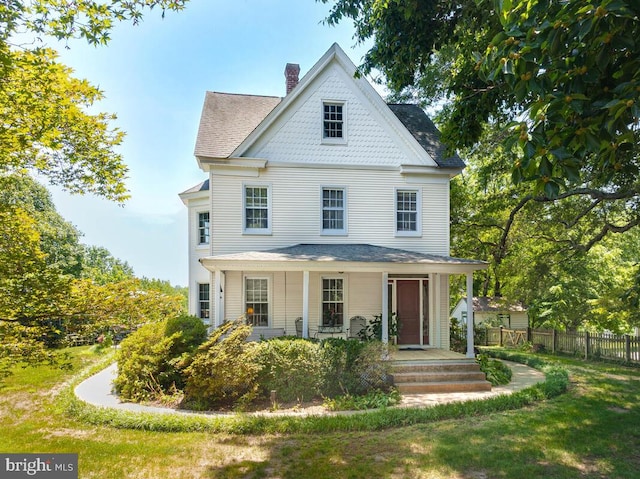 2090 Clearview Dr, Owings, MD 20736 - victorian house featuring a chimney and a porch
