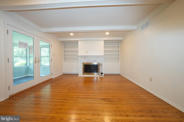 1420 E Boot Rd, West Chester, PA 19380 - unfurnished living room with beamed ceiling, light wood-style floors, crown molding, french doors, and a fireplace