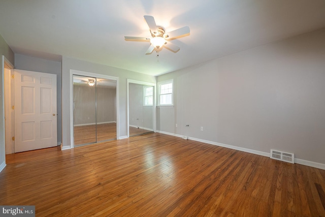 1420 E Boot Rd, West Chester, PA 19380 - unfurnished bedroom featuring multiple closets, wood finished floors, and a ceiling fan