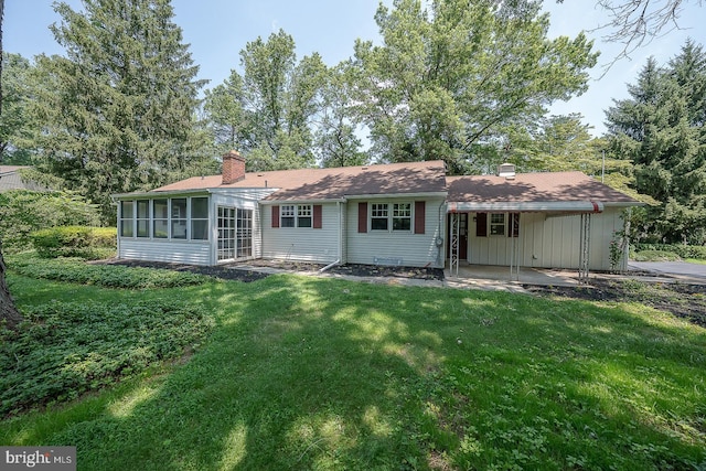 1420 E Boot Rd, West Chester, PA 19380 - back of property with a chimney, a yard, a sunroom, and a patio