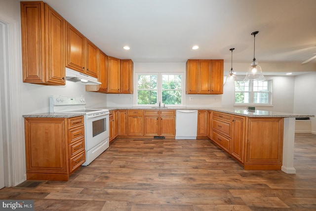 1420 E Boot Rd, West Chester, PA 19380 - kitchen featuring white appliances, under cabinet range hood, a peninsula, dark wood-style flooring, and light stone countertops