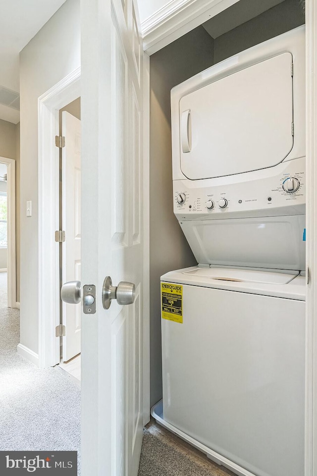2721 E Chase St, Baltimore, MD 21213 - laundry area featuring estacked washer and dryer and carpet floors