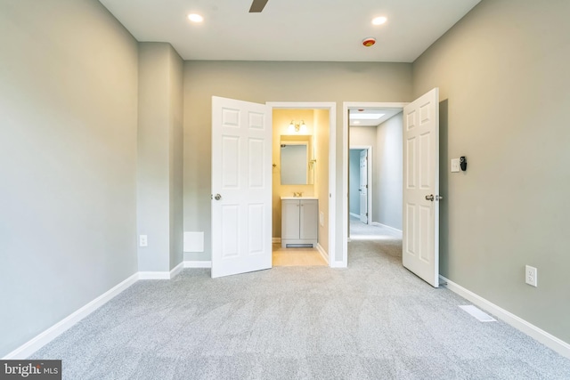 2721 E Chase St, Baltimore, MD 21213 - unfurnished bedroom featuring light colored carpet, recessed lighting, and ensuite bath