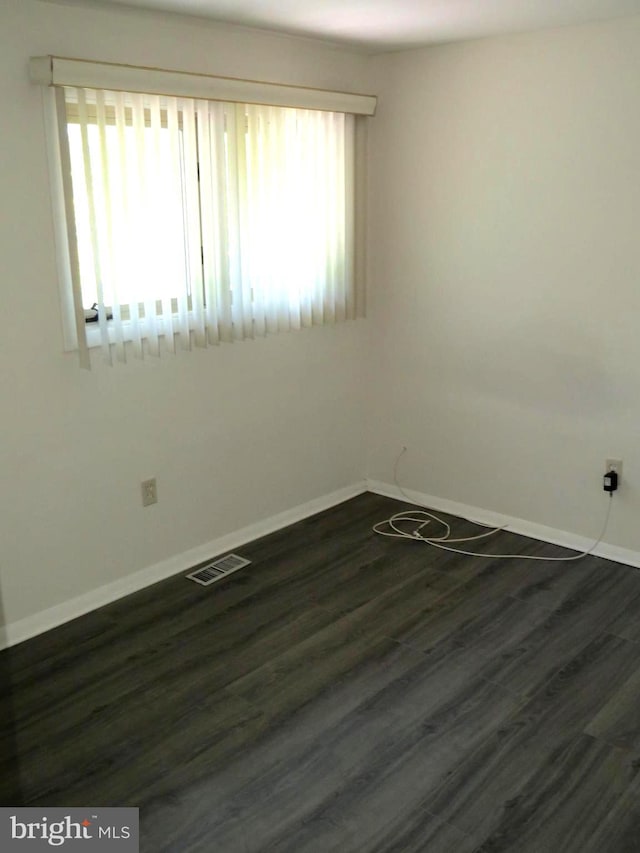 1208 Pickering Cir, Upper Marlboro, MD 20774 - spare room featuring healthy amount of natural light and dark wood-style floors