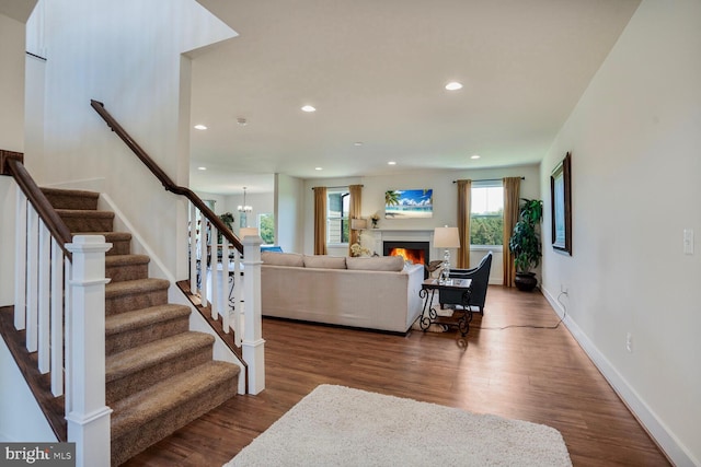 11100 Slate Landing Ln, Nokesville, VA 20181 - living room with wood finished floors, stairs, recessed lighting, and a warm lit fireplace