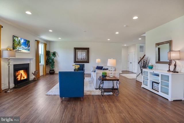 11100 Slate Landing Ln, Nokesville, VA 20181 - living area with a glass covered fireplace, wood finished floors, recessed lighting, and stairs