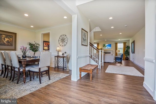 11100 Slate Landing Ln, Nokesville, VA 20181 - dining area with stairway, wood finished floors, recessed lighting, ornamental molding, and a fireplace