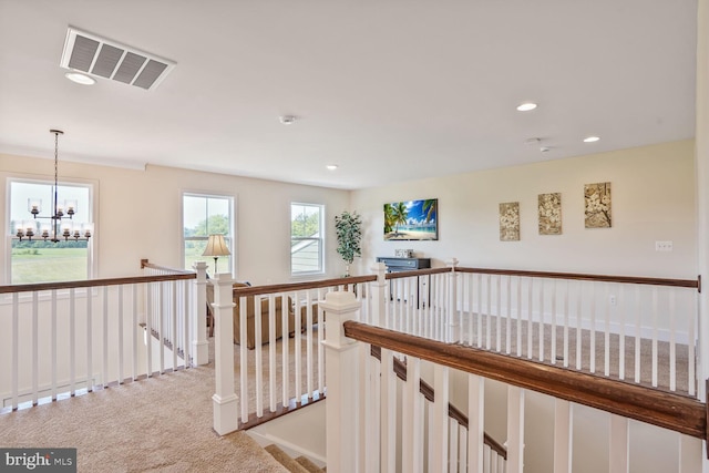 11100 Slate Landing Ln, Nokesville, VA 20181 - hall with an upstairs landing, light carpet, a chandelier, and recessed lighting