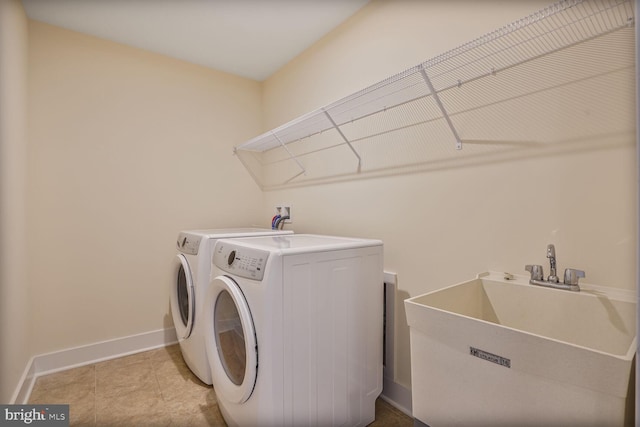 11100 Slate Landing Ln, Nokesville, VA 20181 - washroom with washer and clothes dryer and baseboards