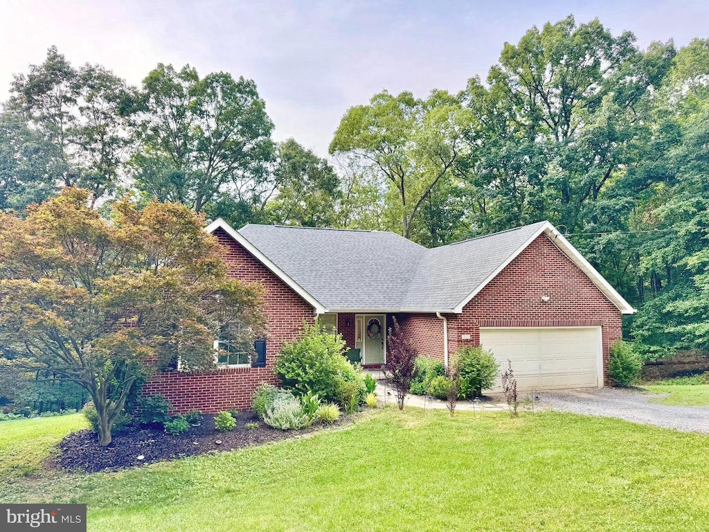 311 Akern Ln, Cross Junction, VA 22625 - view of front facade with a front yard, brick siding, driveway, and an attached garage