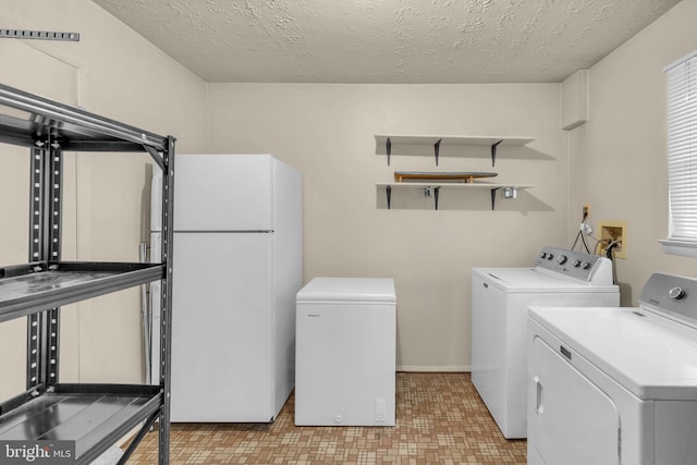 1848 Statesman Ct, Severn, MD 21144 - laundry room featuring washing machine and clothes dryer and a textured ceiling