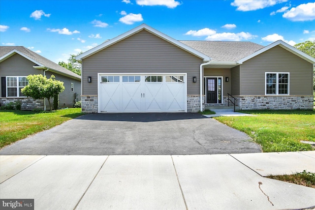 51FRANKLINDR Franklin Dr, Mechanicsburg, PA 17055 - view of front facade with stone siding, a front lawn, driveway, and an attached garage