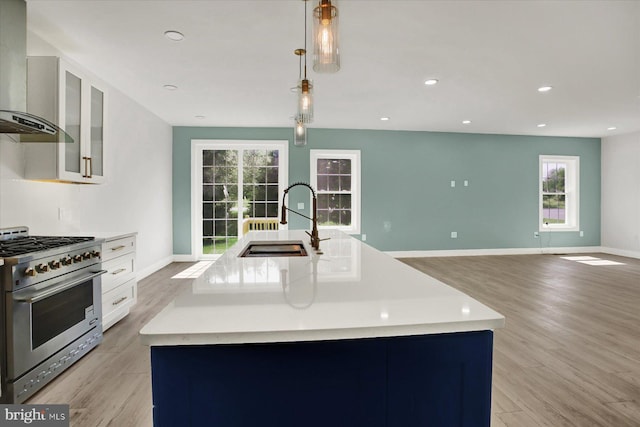51FRANKLINDR Franklin Dr, Mechanicsburg, PA 17055 - kitchen featuring high end stainless steel range, wall chimney range hood, light wood-type flooring, light countertops, and recessed lighting
