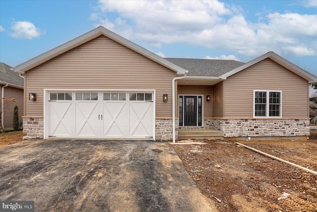 51FRANKLINDR Franklin Dr, Mechanicsburg, PA 17055 - view of front of house featuring stone siding, driveway, and an attached garage