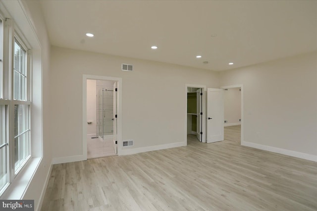 51FRANKLINDR Franklin Dr, Mechanicsburg, PA 17055 - unfurnished bedroom featuring light wood finished floors, multiple windows, a walk in closet, recessed lighting, and connected bathroom
