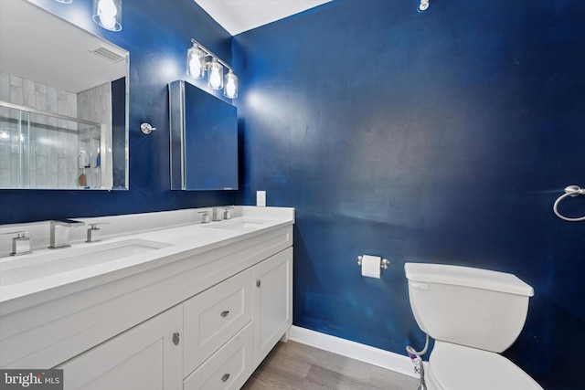 213 Buchanan Ct, Downingtown, PA 19335 - full bath featuring double vanity, an enclosed shower, and wood finished floors