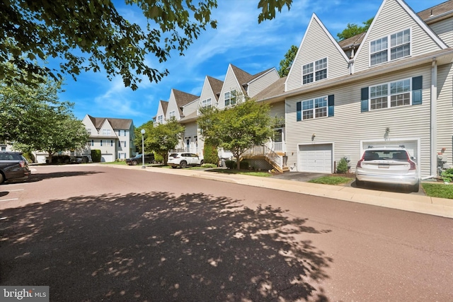 213 Buchanan Ct, Downingtown, PA 19335 - view of asphalt street featuring a residential view, street lighting, sidewalks, and curbs