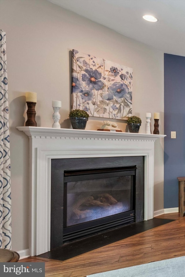 213 Buchanan Ct, Downingtown, PA 19335 - detailed view of a glass covered fireplace, recessed lighting, and wood finished floors