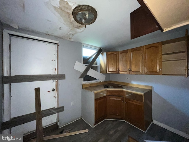 2532 W Baltimore St, Baltimore, MD 21223 - kitchen with brown cabinets and dark wood-style floors