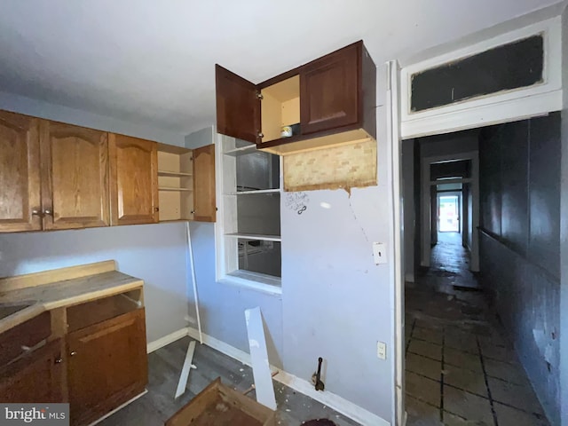 2532 W Baltimore St, Baltimore, MD 21223 - kitchen featuring brown cabinetry