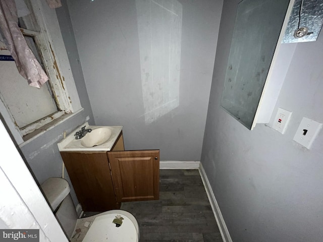 2532 W Baltimore St, Baltimore, MD 21223 - half bath featuring vanity and wood finished floors