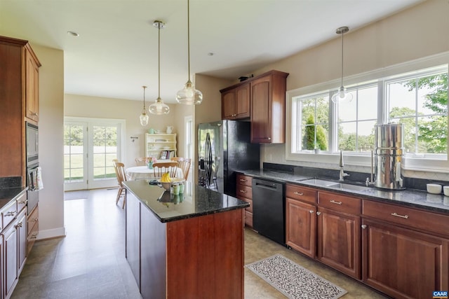 928 Slate Mill Rd Unit B, Stanardsville, VA 22973 - kitchen featuring black appliances, a kitchen island, dark stone counters, light flooring, and decorative light fixtures