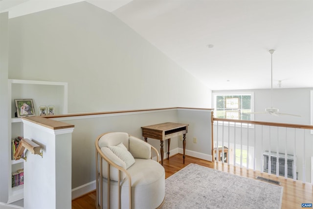 928 Slate Mill Rd Unit B, Stanardsville, VA 22973 - sitting room with lofted ceiling, a ceiling fan, wood finished floors, and an upstairs landing