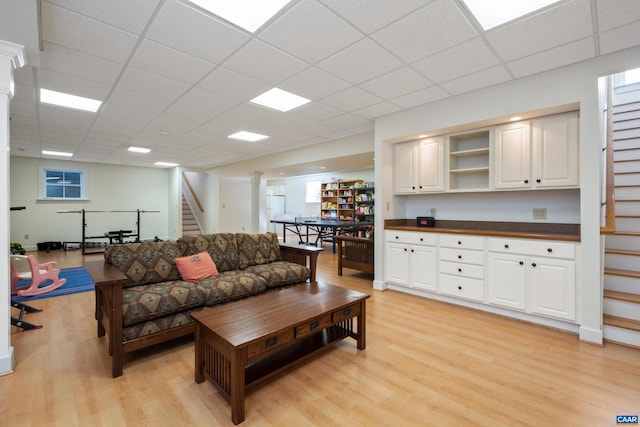 928 Slate Mill Rd Unit B, Stanardsville, VA 22973 - living room featuring stairway, light wood finished floors, and a paneled ceiling