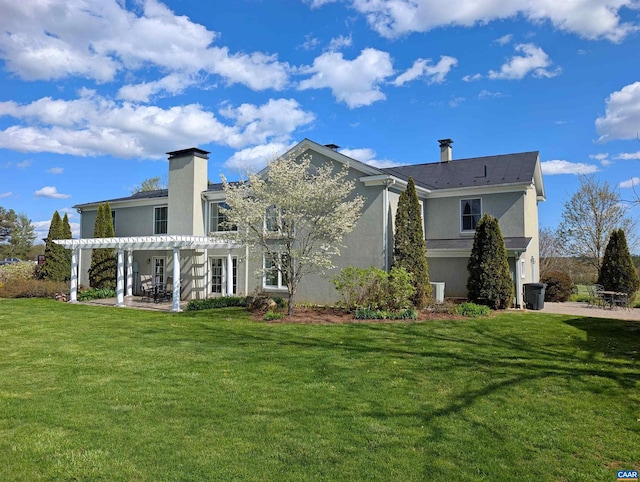 928 Slate Mill Rd Unit B, Stanardsville, VA 22973 - back of property featuring a pergola, stucco siding, a chimney, and a yard