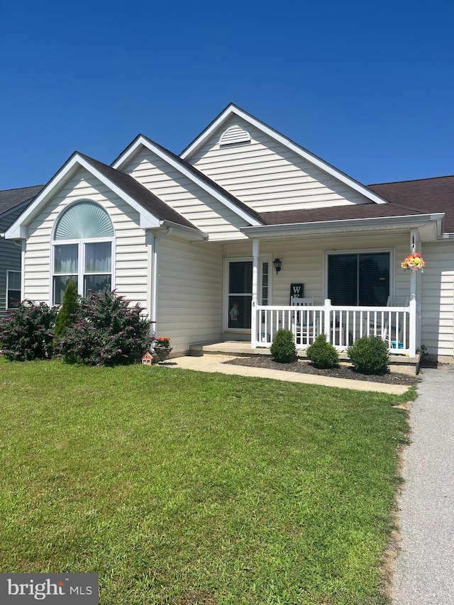 8 Aidone Ln, Smyrna, DE 19977 - ranch-style house with a porch and a front yard