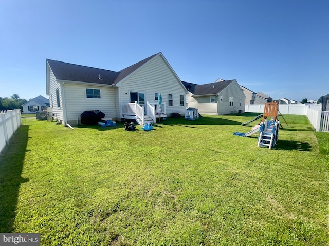 8 Aidone Ln, Smyrna, DE 19977 - back of property with a playground and a fenced backyard
