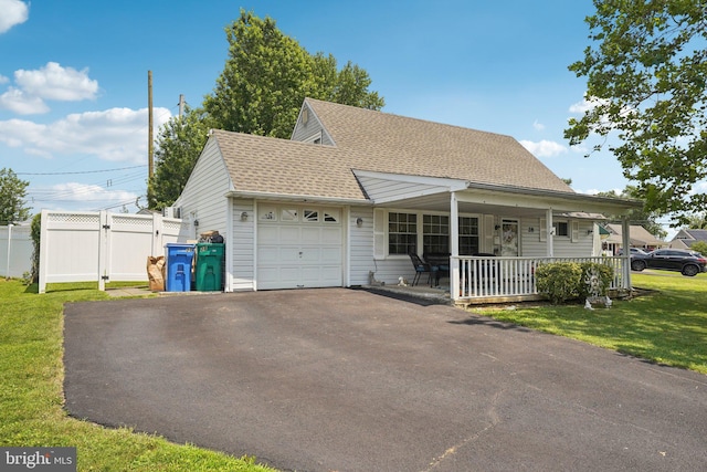 28 Indian Red Rd, Levittown, PA 19057 - view of front of home with a porch, a garage, asphalt driveway, and a shingled roof