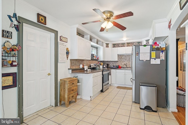 28 Indian Red Rd, Levittown, PA 19057 - kitchen featuring appliances with stainless steel finishes, white cabinetry, a ceiling fan, ornamental molding, and decorative backsplash