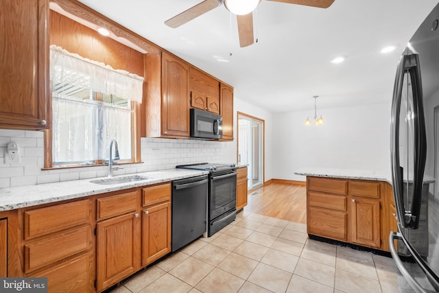 2621 Dartmouth Woods Rd, Wilmington, DE 19810 - kitchen featuring freestanding refrigerator, black microwave, dishwasher, decorative backsplash, and ceiling fan