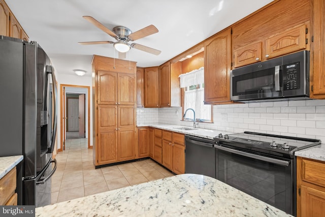 2621 Dartmouth Woods Rd, Wilmington, DE 19810 - kitchen featuring appliances with stainless steel finishes, a ceiling fan, backsplash, light tile patterned flooring, and light stone counters
