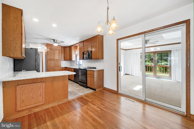 2621 Dartmouth Woods Rd, Wilmington, DE 19810 - kitchen with black appliances, a ceiling fan, tasteful backsplash, light wood-style floors, and recessed lighting